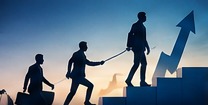 Team members helping one another climb steps toward a shared goal.